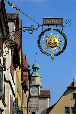 Ornate wrought iron shop sign advertising a gasthof (guesthouse), Rothenburg ob der Tauber, Bavaria (Bayern), Germany, Europe Stock Photo - Rights-Managed, Code: 841-03063143
