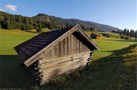 Wooden barns dot the alpine landscape, near Garmisch-Partenkirchen and Mittenwald, Bavaria (Bayern), Germany, Europe Stock Photo - Rights-Managed, Code: 841-03063188