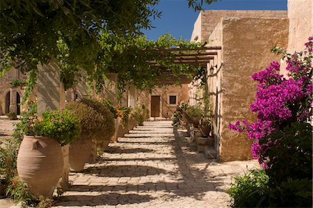 Terracotta urns and flowers in the cloister at Arkadhi Monastery (Moni Arkadhi), twenty-five miles from Rethymnon, Crete, Greek Islands, Greece, Europe Stock Photo - Rights-Managed, Code: 841-03483723