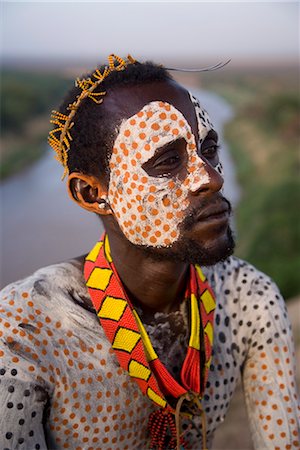simsearch:841-08059656,k - Portrait of a Karo tribesman with facial decoration in chalk imitating the spotted plumage of the guinea fowl, Lower Omo Valley, Ethiopia, Africa Stock Photo - Rights-Managed, Code: 841-03505103