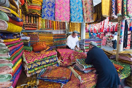 Silk fabrics being sold at the Sunday market, Kashgar (Kashi), Xinjiang Provice, China, Asia Stock Photo - Rights-Managed, Code: 841-03505570
