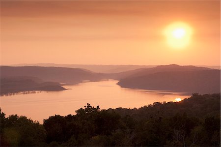 View of sunset over Lake Yaxha from Temple 216, Yaxha, Guatemala, Central America Stock Photo - Rights-Managed, Code: 841-03505704