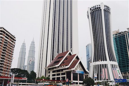 petronas towers - Petronas Towers and Tabung Haji Building, designed by Hijas Katsuri, Kuala Lumpur, Malaysia, Southeast Asia, Asia Stock Photo - Rights-Managed, Code: 841-03517402