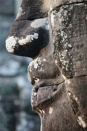 Detail of stone face, which may depict Jayavarman VII as a Bodhisattva, on towers in the Bayon Temple, Angkor Thom, Angkor, UNESCO World Heritage Site, Siem Reap, Cambodia, Indochina, Southeast Asia, Asia Stock Photo - Rights-Managed, Code: 841-03675988