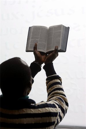 African man reading the Bible in a church, Paris, France, Europe Stock Photo - Rights-Managed, Code: 841-03676019