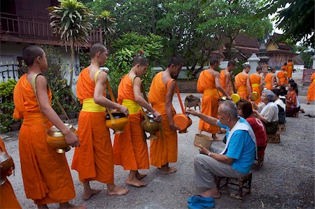 simsearch:841-05845843,k - Monks processing at dawn for alms of rice in Luang Prabang, Laos, Indochina, Southeast Asia, Asia Stock Photo - Rights-Managed, Code: 841-03676046