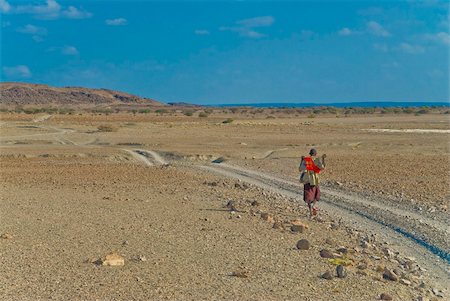 Afar tribesman on his way home, near Lac Abbe, Republic of Djibouti, Africa Stock Photo - Rights-Managed, Code: 841-03676811