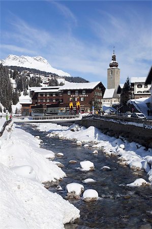 snowy austria village - Hotel Krone, river and village church, Lech near St. Anton am Arlberg in winter snow, Austrian Alps, Austria, Europe Stock Photo - Rights-Managed, Code: 841-03677477