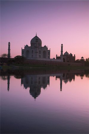 famous buildings in india - The Taj Mahal, UNESCO World Heritage Site, at sunset reflected in the Yamuna River, Agra, Uttar Pradesh, India, Asia Stock Photo - Rights-Managed, Code: 841-03672202