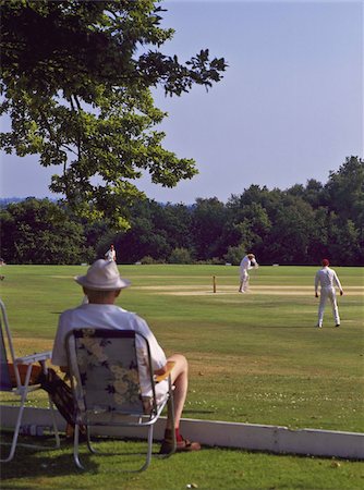 Man watching a game of cricket on Southborough Common, near Tunbridge Wells, Kent, England, United Kingdom, Europe Stock Photo - Rights-Managed, Code: 841-03672267