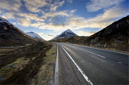 A82 trunk road heading across Rannoch Moor towards Glencoe with snow-covered mountains in distance and dramatic evening sky, Rannoch Moor, near Fort William, Highland, Scotland, United Kingdom, Europe Stock Photo - Rights-Managed, Code: 841-03672408