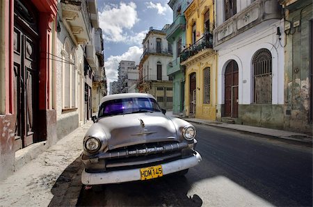 simsearch:841-03035281,k - Old American Plymouth car parked on deserted street of old buildings, Havana Centro, Havana, Cuba, West Indies, Caribbean, Central America Stock Photo - Rights-Managed, Code: 841-03672425