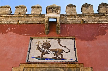 simsearch:700-04424890,k - Royal lion emblem fresco and fortifications above entrance of the Alcazar, Seville, Andalusia, Spain, Europe Stock Photo - Rights-Managed, Code: 841-03672611