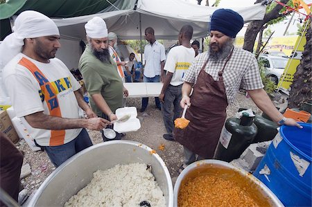 Preparing food for distribution with United Sikhs after the January 2010 earthquake, Port au Prince, Haiti, West Indies, Caribbean, Central America Stock Photo - Rights-Managed, Code: 841-03672769