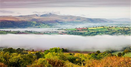 Overlooking mist covered countryside towards Pen y Fan and the Brecon Beacons mountains, Brecon Beacons National Park, Powys, Wales, United Kingdom. Europe Stock Photo - Rights-Managed, Code: 841-03869915