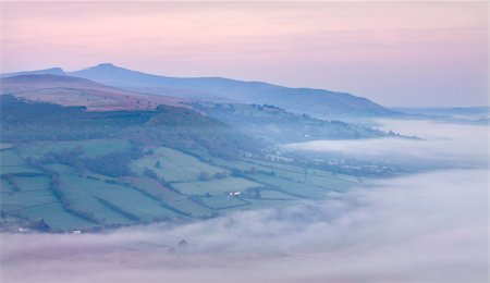 Low hanging mist shrouds the Usk Valley at dawn, viewed from the summit of Allt yr Esgair, Brecon Beacons National Park, Powys, Wales, United Kingdom, Europe Stock Photo - Rights-Managed, Code: 841-03869994