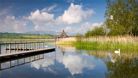 Tranquil morning on Llangorse Lake, with views to the Iron Age Crannog and Pen y Fan beyond, Brecon Beacons National Park, Powys, Wales, United Kingdom, Europe Stock Photo - Rights-Managed, Code: 841-03869998