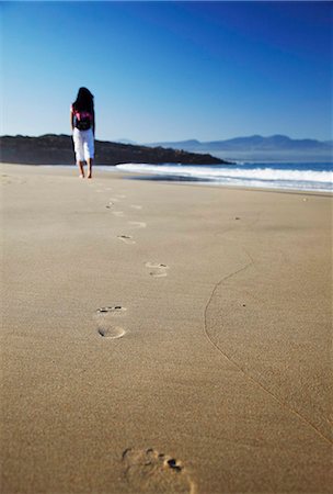 simsearch:859-07284165,k - Woman walking on beach, Plettenberg Bay, Western Cape, South Africa, Africa Stock Photo - Rights-Managed, Code: 841-03870163