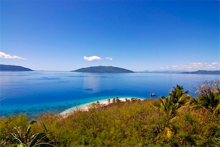 Crystal clear water and white sand beach, in the background Nosy Komab, Nosy Be, Madagascar, Indian Ocean, Africa Stock Photo - Rights-Managed, Code: 841-03870817