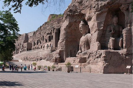 Giant Buddhas at the Yungang Grottoes, ancient Buddhist temple grottoes near the city of Datong, UNESCO World Heritage Site, Shanxi, China. Asia Stock Photo - Rights-Managed, Code: 841-03871031