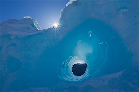 passage - Small tunnel eroded in an iceberg frozen in Mendenhall Lake, Juneau, Southeast Alaska, Winter Stock Photo - Rights-Managed, Code: 854-05974192