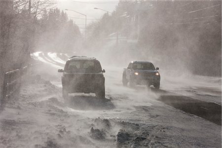 driving in car wind - Vehicles drive on Douglas Roadway obscured by 70 mph blowing wind and snow, Juneau, Southeast Alaska, Winter Stock Photo - Rights-Managed, Code: 854-05974202