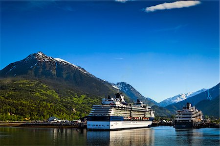 Alaska Marine Highway ferry moored next to a Celebrity Cruises cruise ship at the port of Skagway, Southeast Alaska, Summer Stock Photo - Rights-Managed, Code: 854-05974509