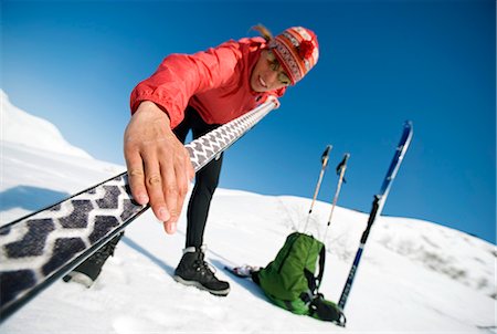 Female skier prepares skis for cross-country skiing in the Center Ridge area of Turnagain Pass of Chugach National Forest, Alaska Stock Photo - Rights-Managed, Code: 854-02954905