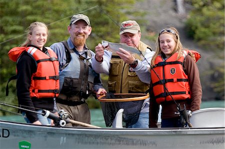 river fish - Family & Guide showing off Rainbow Trout caught from drift boat Kenai River Kenai Peninsula Alaska Stock Photo - Rights-Managed, Code: 854-02955003