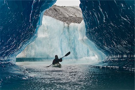 sea kayak - Sea Kayaker paddles through an ice cave amongst giant icebergs near Bear Glacier in Resurrection Bay near Seward, Alaska Stock Photo - Rights-Managed, Code: 854-02955125