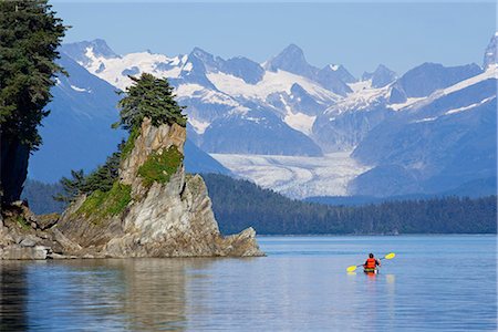 simsearch:854-02955238,k - Sea kayaker in Lynn Canal near rocky coastline w/Herbert Glacier background Southeast Alaska Stock Photo - Rights-Managed, Code: 854-02955149