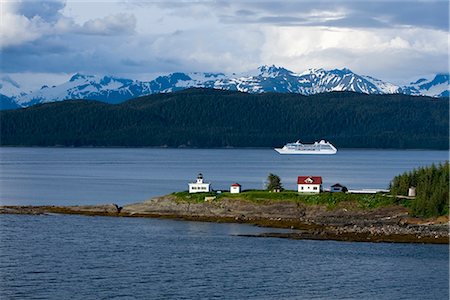 Aerial view of Point Retreat Light House at the tip of Mansfield Penninsula with Admiralty Island and a cruise ship in the background, Southeast, Alaska Stock Photo - Rights-Managed, Code: 854-02955496