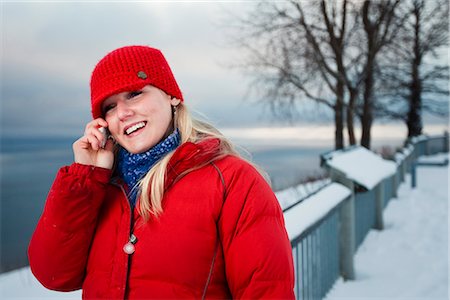 Young woman talks on cell phone at the Baycrest pullout on the sterling highway near Homer, Alaska during Winter Stock Photo - Rights-Managed, Code: 854-02955934