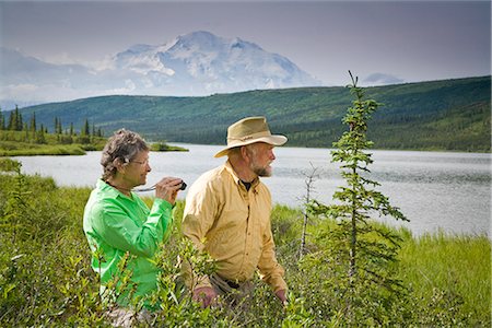 simsearch:854-03538162,k - Mature couple hike and enjoy scenery at Wonder Lake with Mt.Mckinley in background in  Denali National Park, Alaska during Summer Stock Photo - Rights-Managed, Code: 854-02956191