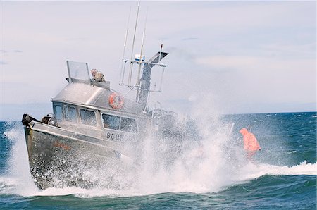 A gillnetter travels through rough seas to make its way to the next set,  Bristol Bay, Alaska/n Stock Photo - Rights-Managed, Code: 854-03362260