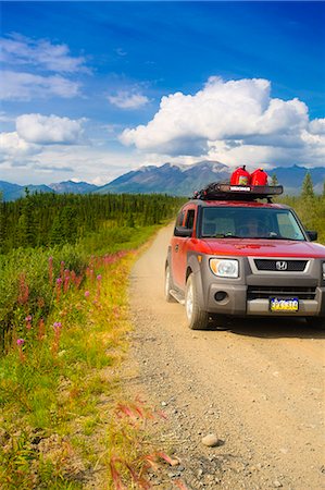 Car travelling on Nabesna Road in Wrangell Saint Elias National Park with the  Mentasta Mountains in the background, Southcentral Alaska, Summer Stock Photo - Rights-Managed, Code: 854-03466924