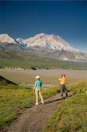 simsearch:854-03538162,k - A young couple walk along a hard path near the Eielson visitor center with MtMcKinley in the background Denali NP Alaska Stock Photo - Rights-Managed, Code: 854-03538149