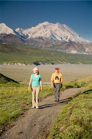 simsearch:854-03538162,k - A young couple walk along a hard path near the Eielson visitor center with MtMcKinley in the background Denali NP Alaska Stock Photo - Rights-Managed, Code: 854-03538150