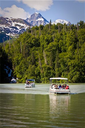 Guests of Redoubt Bay Lodge view Chigmit Mountains and scenery from pontoon boat on Big River Lakes in   Redoubt Bay State Critical Habitat Area, Southcentral, Alaska Stock Photo - Rights-Managed, Code: 854-03538541