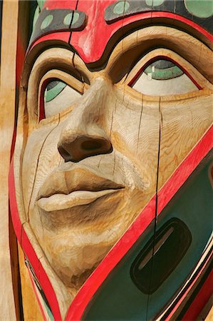 Close up of a face on a traditional Haida totem carving in Ketchikan, Alaska Stock Photo - Rights-Managed, Code: 854-03538657