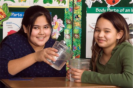 Alaskan native girls in classroom setting Inside pouring water science Stock Photo - Rights-Managed, Code: 854-03538791