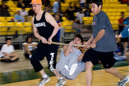 simsearch:854-03538943,k - Boy's doing Wrist Carry 2006 Senior Native Youth Olympic Games Alaska Anchorage Sullivan Arena Stock Photo - Rights-Managed, Code: 854-03538930