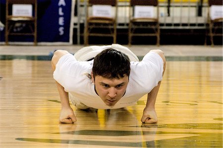 simsearch:854-03538943,k - Boy doing Seal Hop Jump 2006 Senior Native Youth Olympic Games Alaska Anchorage Sullivan Arena Stock Photo - Rights-Managed, Code: 854-03538932