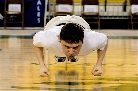 simsearch:854-03538943,k - Boy doing Seal Hop Jump 2006 Senior Native Youth Olympic Games Alaska Anchorage Sullivan Arena Stock Photo - Rights-Managed, Code: 854-03538933
