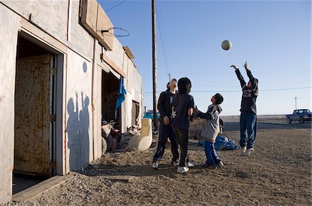 simsearch:854-03538943,k - Native boys playing basketball outside in late summer sun Kaktovik Alaska Arctic Stock Photo - Rights-Managed, Code: 854-03538947