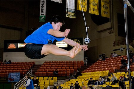 simsearch:854-03538943,k - Boy doing Two-Foot High Kick 2006 Senior Native Youth Olympic Games Alaska Anchorage Sullivan Arena Stock Photo - Rights-Managed, Code: 854-03538941
