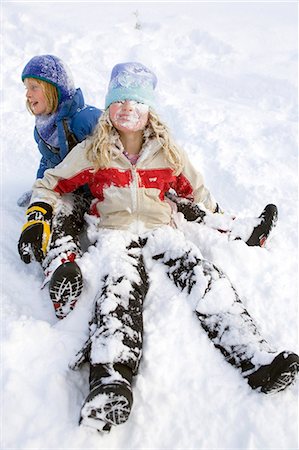 Two young girls playing in snow and  sledding at Ohlson Mountain near Homer, Alaska Stock Photo - Rights-Managed, Code: 854-03539084