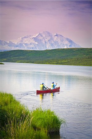 Mature couple canoes on Wonder Lake with Mt. Mckinley in background in Denali National Park, Alaska during Summer Stock Photo - Rights-Managed, Code: 854-03539385