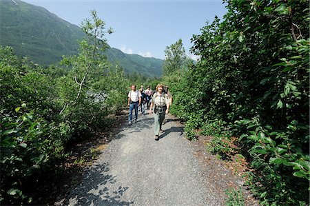 simsearch:854-02955238,k - Female Forest Service guide leading hikers on a trail to Spencer Glacier as part of the Alaska Railroad's Spencer Whistle Stop Camping tour, Southcentral Alaska, Summer Stock Photo - Rights-Managed, Code: 854-03645927