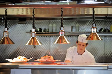 people restaurant lights interior - Cook prepares food at City Diner in Anchorage, Southcentral Alaska, Summer/n Stock Photo - Rights-Managed, Code: 854-03646294